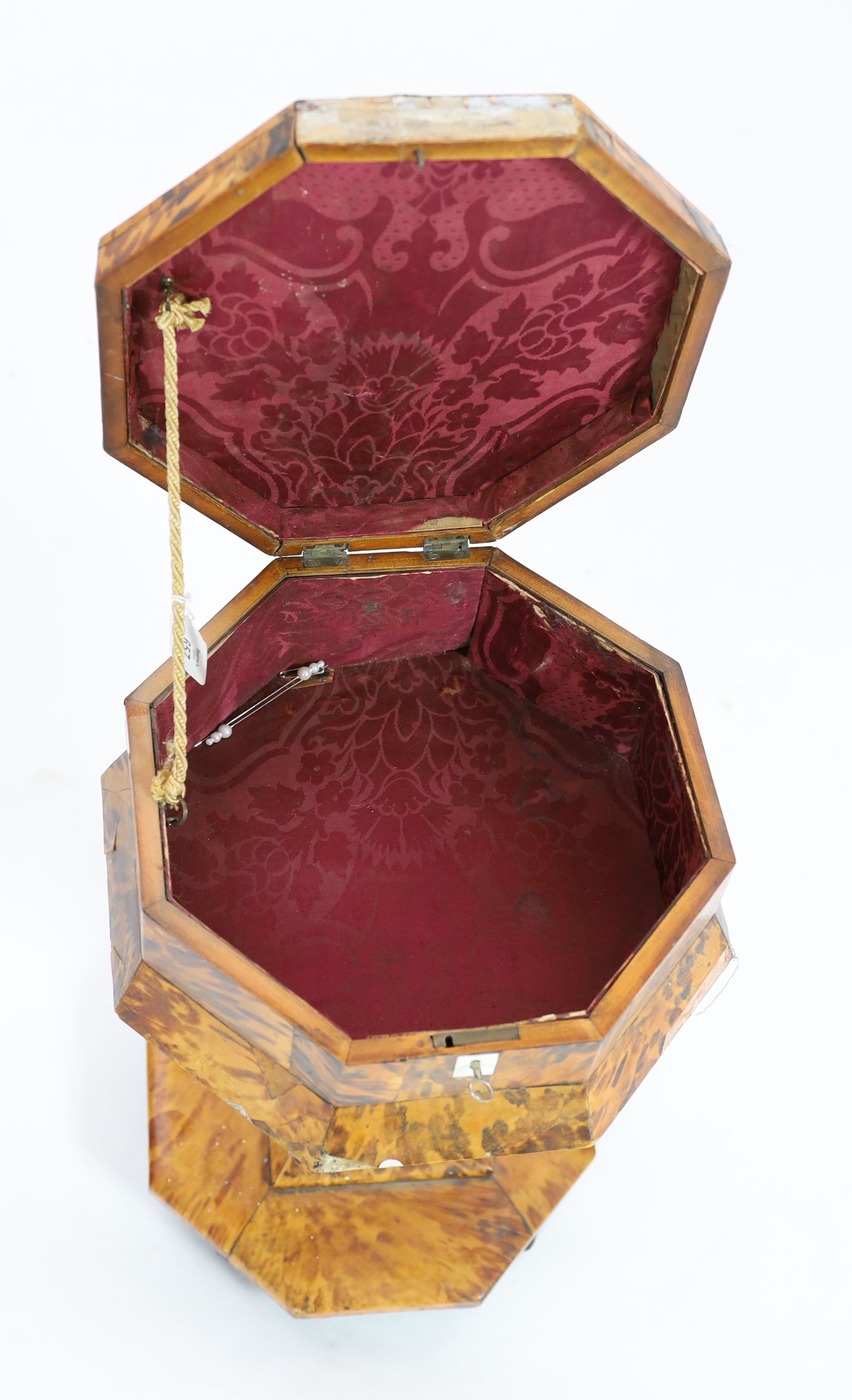 A mid 19th century tortoiseshell veneered pedestal work table, 48cm high 34cm diameter